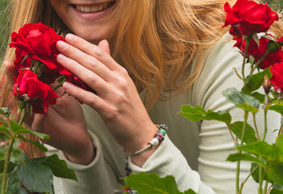 Trollbeads full bracelet on a model holding a flower pot
